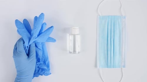 Hygiene Supplies: Sanitizer, Gloves, and Mask Arrangement