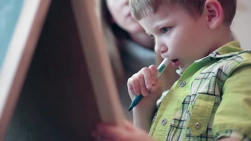 Mother Tells Her Son That He Needs To Write on the Board