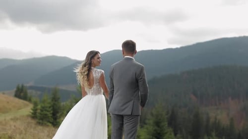 Lovely Caucasian Wedding Couple Newlyweds Family Bride Groom Stay Together on Mountain Slope Hill