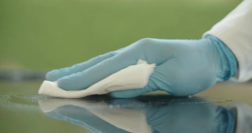 Hand in Glove Wipes and Cleans Reflective Surface