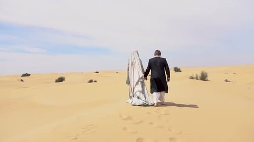 Newlyweds Walking in the Desert