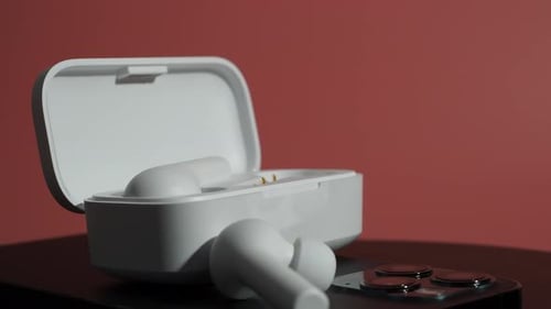 White Wireless Earbuds on a Smart Phone