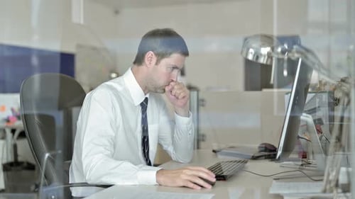 Sick Middle Aged Businessman Working on Office Computer and Doing Coughing