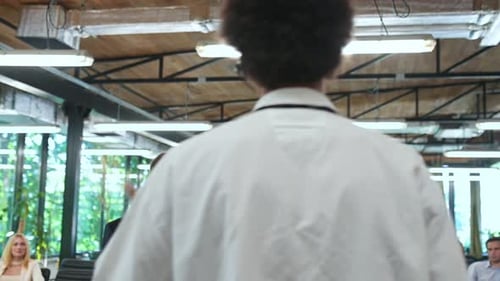 Engaging Speaker Presents to Attentive Audience at Conference