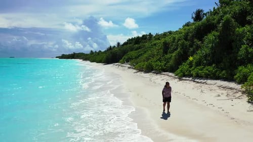 Girl sunbathes on luxury lagoon beach vacation by blue ocean and white sandy background of the Maldi