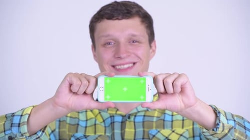 Young Adult Presenting Phone with Chroma Key Screen