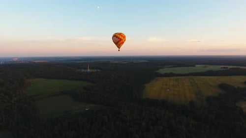 Hot Air Balloon in the Sky Over a Field