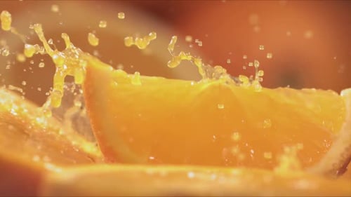Quarter Slice of Orange Splashing with Juice