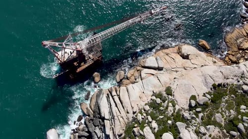 Aerial view of shipwreck crane barge is off the coast of Sandy Bay.