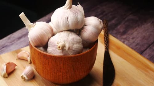Close Up Pf Garlic in a Container on Table