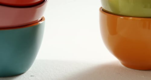 Stacks of Colorful Ceramic Bowls for Food Preparation