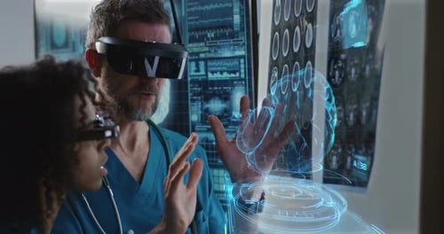 Male and Female Doctor Examining Brain Scan