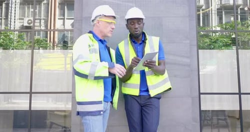 Diversity team senior industry engineer discuss for report in tablet