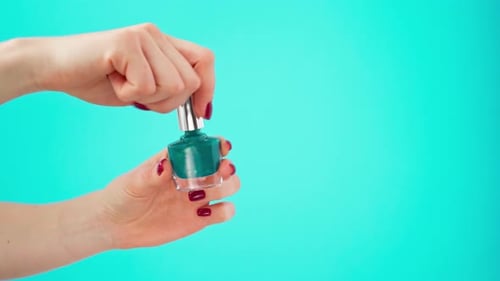 Turquoise Nail Polish Bottle Opened in Studio Setting