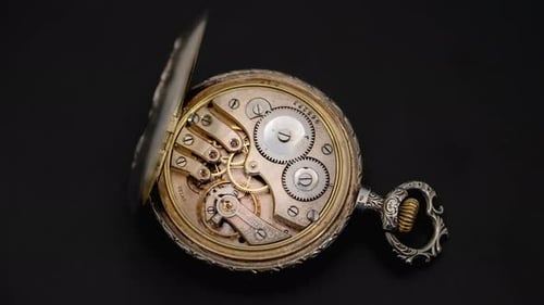 Rotating Mechanism of the Gears of an Antique Pocket Watch. Close Up. Time Lapse . Back Background
