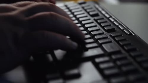 Close up Businessman hands typing on computer keyboard.