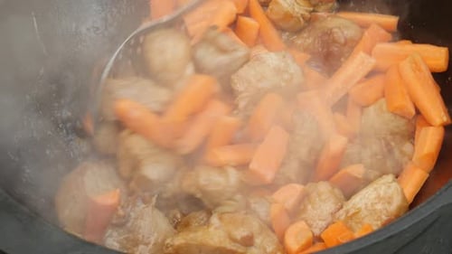 Meat and Carrots Cooking in Large Pot
