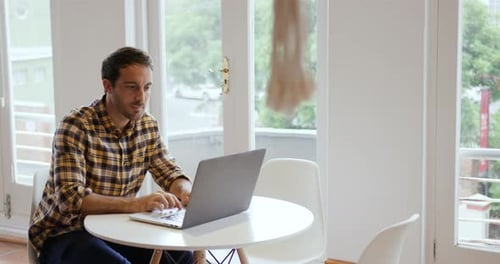 Millennial male professional working in a creative office