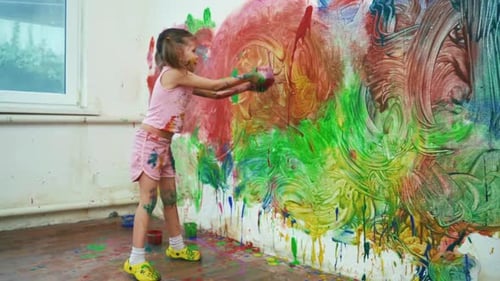 Little Girl Child Preschooler Draws Hands Paints On White Wall
