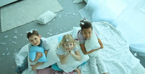 Smiling Children Posing Together in Bright Room