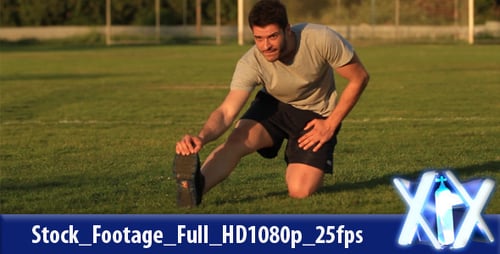 Young Man Stretching on Sunny Green Soccer Field