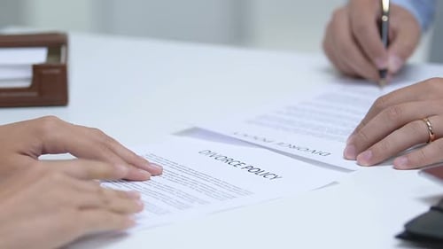 Young Couple Signing Divorce Policy, Taking Off Engagement Rings From Fingers
