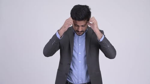 Man in Suit with Headache