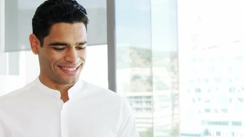 Businessman using digital tablet in a modern office 4k