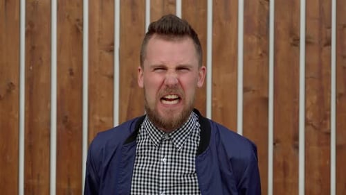 Angry Man Yelling and Gesturing at Camera