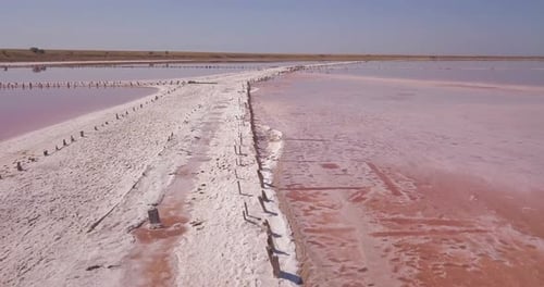 Flight over a pink saline lake
