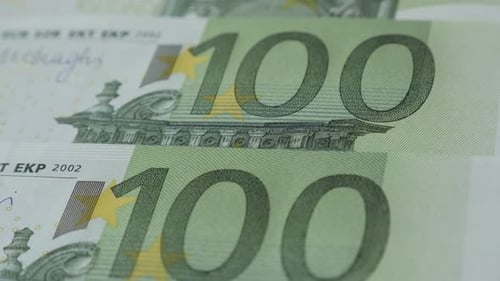 Hundred paper Euro currency slow tilt 4K 2160p 30fps UltraHD footage - Rows of EU banknotes money