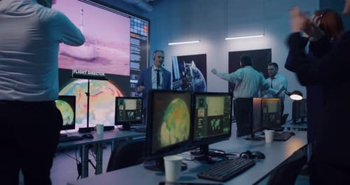 Excited Team Celebrating Successful Rocket Launch