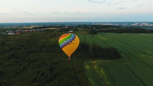 Hot Air Balloon in the Sky Over a Field