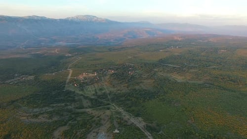 Aerial view of remote village in green valley