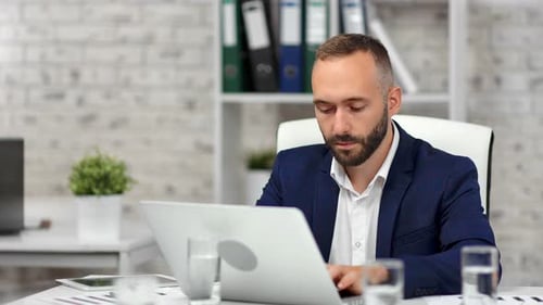 Confident Stylish Businessman in Suit Focused Looking at Screen of Laptop Pc Typing Text at Office