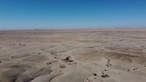 Huge desert with amazing grey sand, stunning landscape view, blue sky