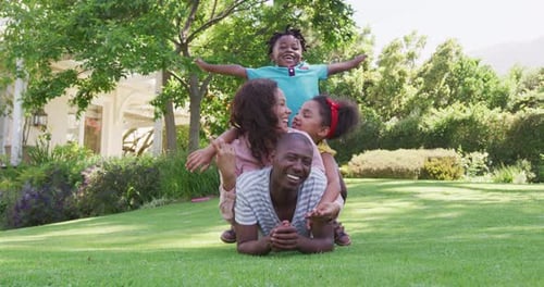 African American family spending time in the garden together
