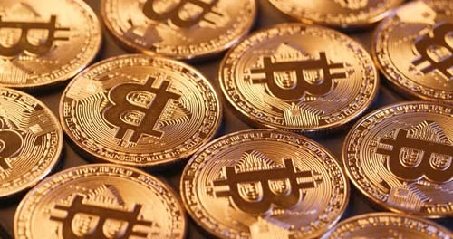 Gold Bitcoin Currency Coins Scattered Together