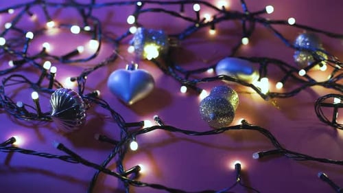 Holiday Ornaments and Lights on Colorful Surface
