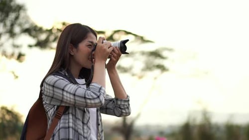 Woman Taking Pictures Outdoors in Nature