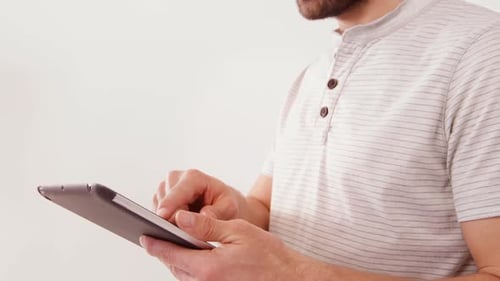 Adult Using Tablet Device with Fingers