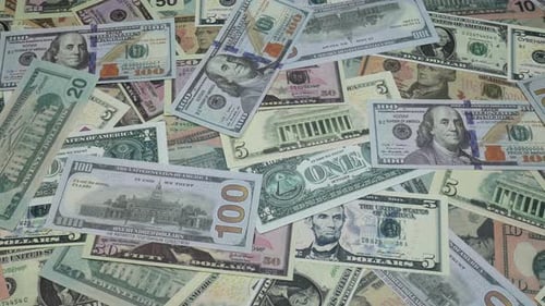 Dollar Bills Of Different Denominations On The Table