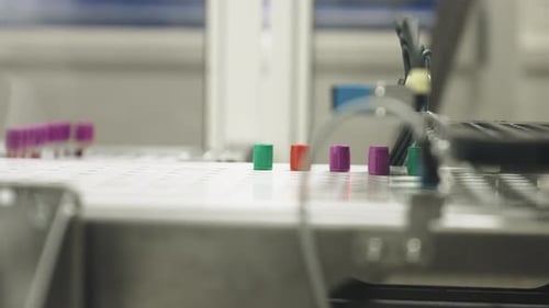 Automated Lab Machine Arm Moves Test Tubes