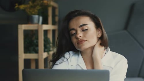 Tired and Stressed Freelnacer in Loft Cafe with Laptop