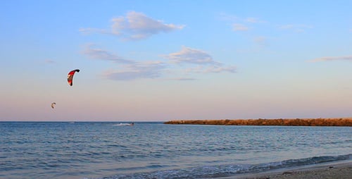Kitesurfers Surfing In The Sea