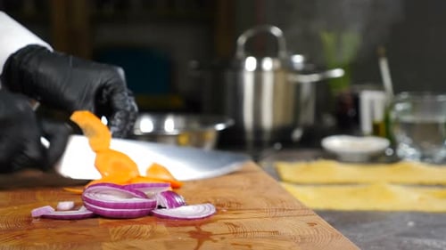 Chef Chopping Vegetables in Restaurant Kitchen