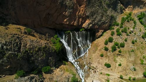 Rocky Waterfall In Mountain