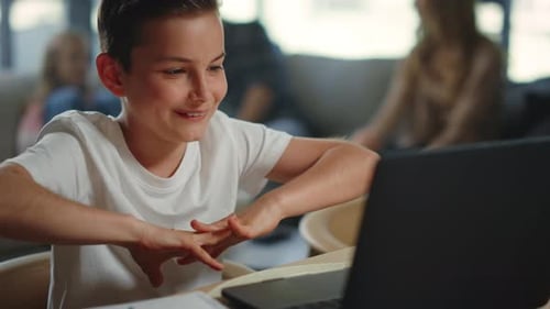 Boy Using Laptop at Home
