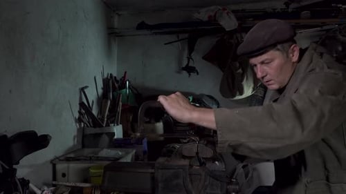 A Man Works in an Old Home Workshop