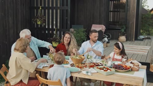 Generational Family Meal on Porch in Daylight